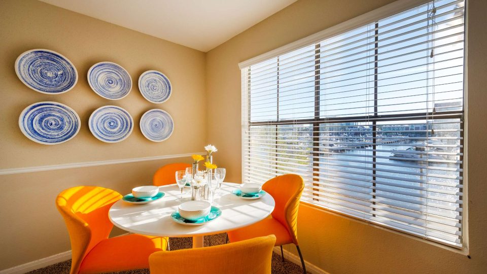 Apartment dining nook beside a window with marina views at Anchor at South Shore in League City, TX
