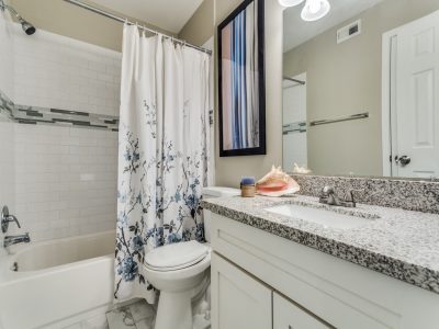 Bathroom with shower-tub combination and granite vanity at Clear Creek Landing in Houston, TX
