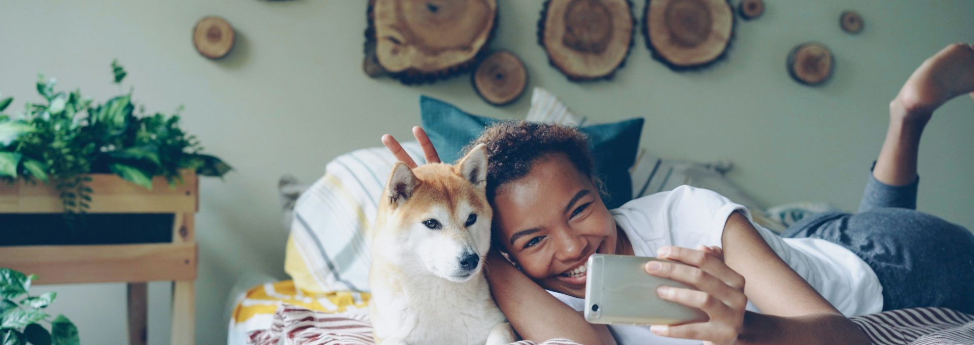A woman takes a selfie with her dog.
