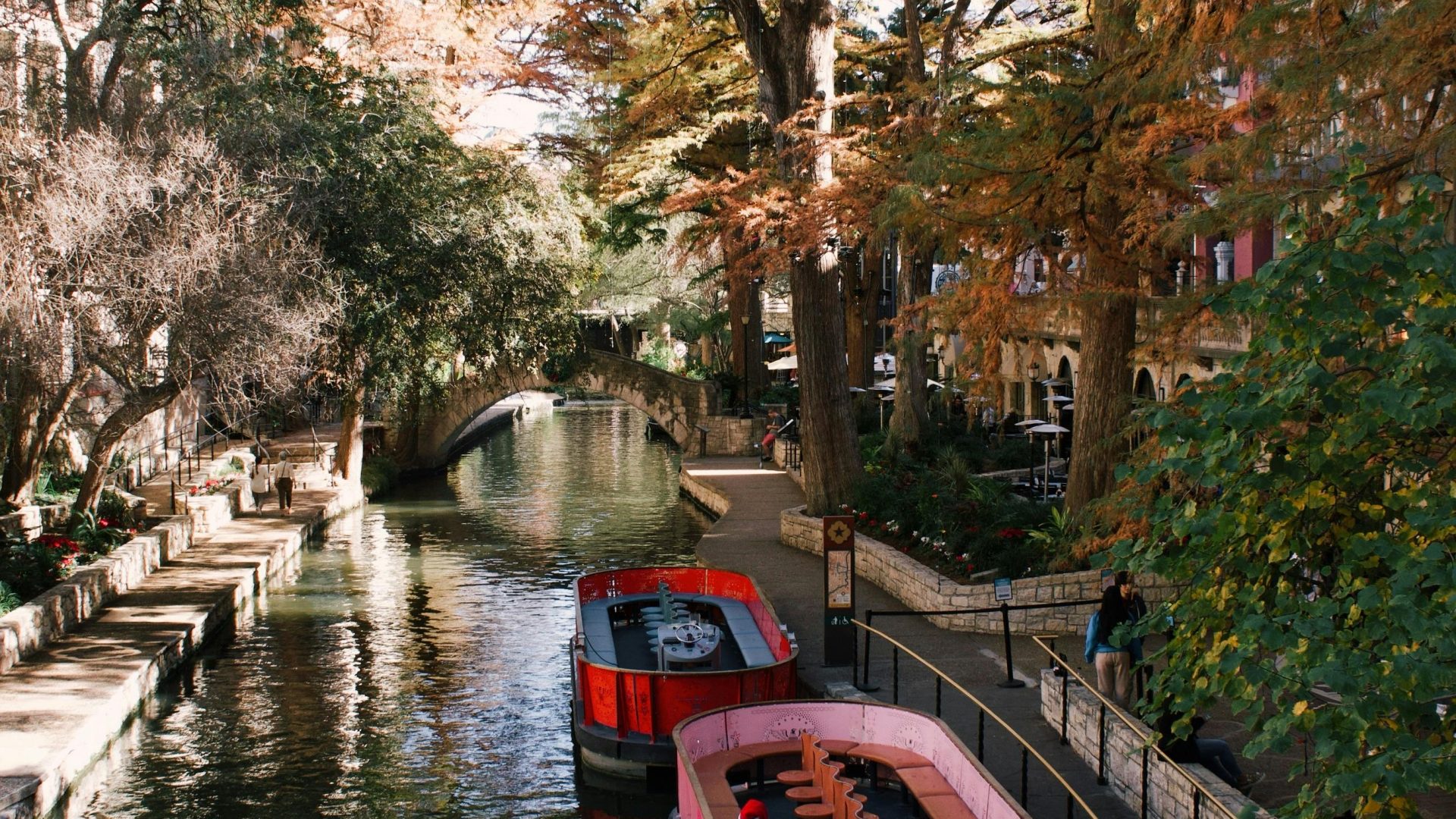 a canal with boats on it and some trees at The Westmount at Three Fountains