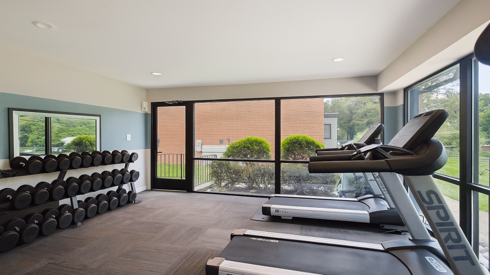 a large room with a lot of chairs and a large window