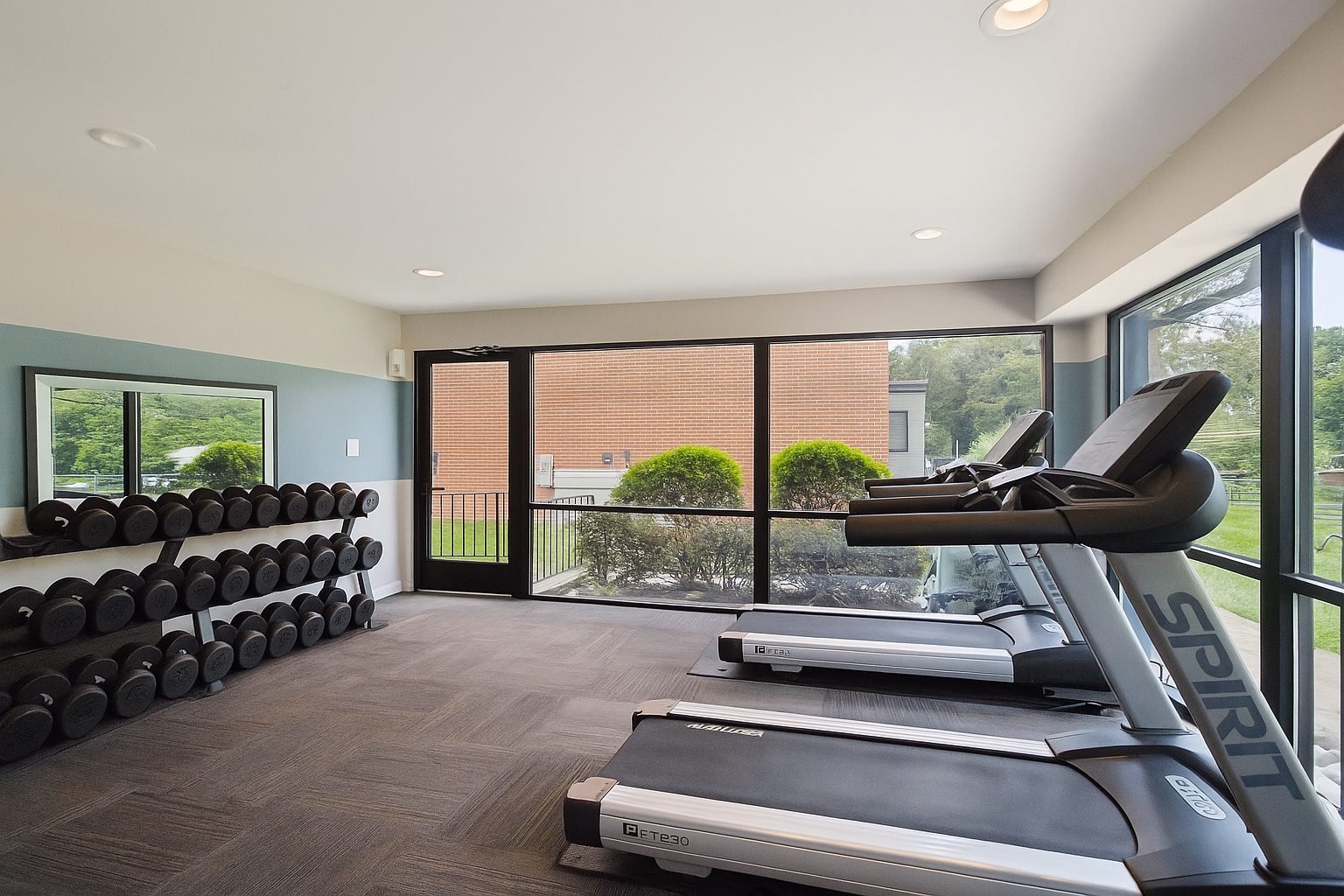 a large room with a lot of chairs and a large window