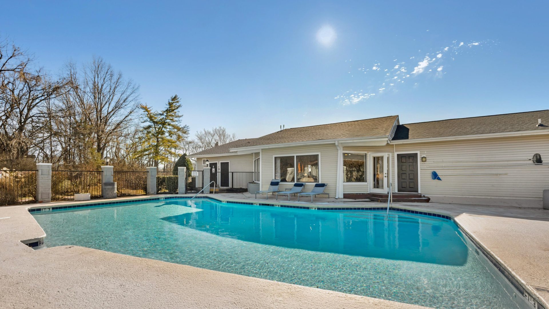 a large pool in front of a house at The  Darby