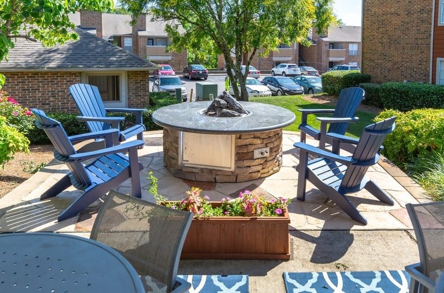 a patio with chairs and a fire pit at The Hickory Highlands
