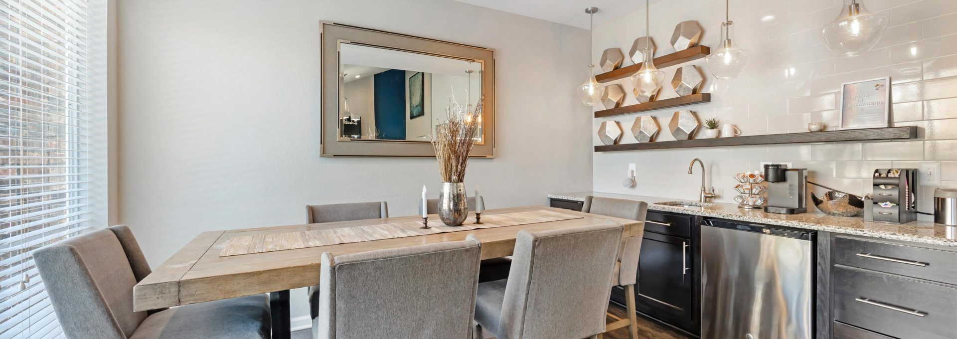a kitchen with a dining table and chairs at The  Landry