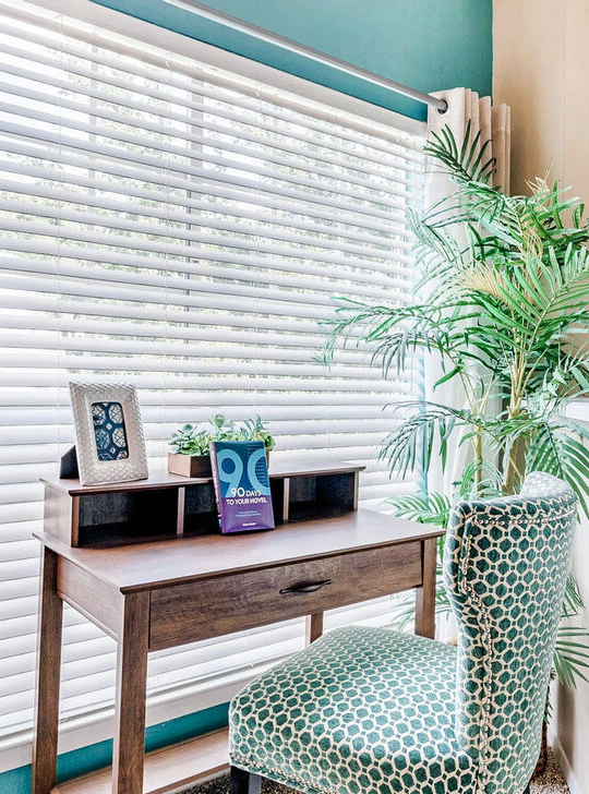 a desk with a chair and a plant in front of it at The Landmark At Gleneagles