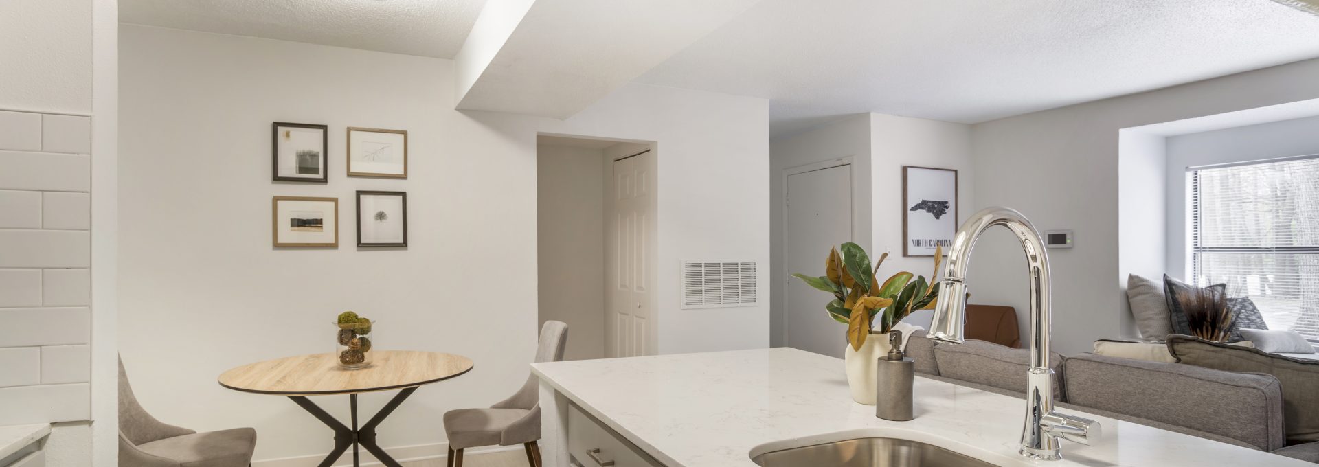 a kitchen with a sink and a table in it at The  Monte