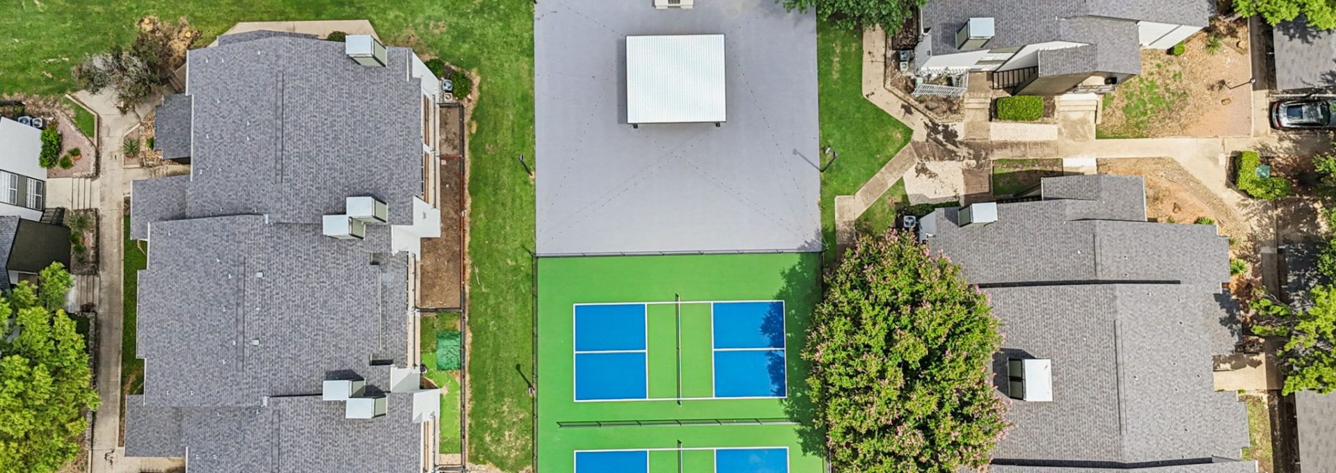 an aerial view of a tennis court in a residential neighborhood at The  Monte