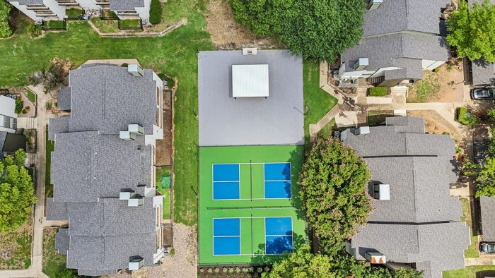 an aerial view of a tennis court in a residential neighborhood at The  Monte
