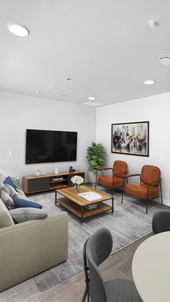 Two-Bedroom Luxury Apartments in Conroe, TX - Soltera Rolling Pines - Living Room with Wood Plank Flooring, Couch, Coffee Table, Armchairs, Wall-Mounted TV, Media Cabinet, and Wall Art.