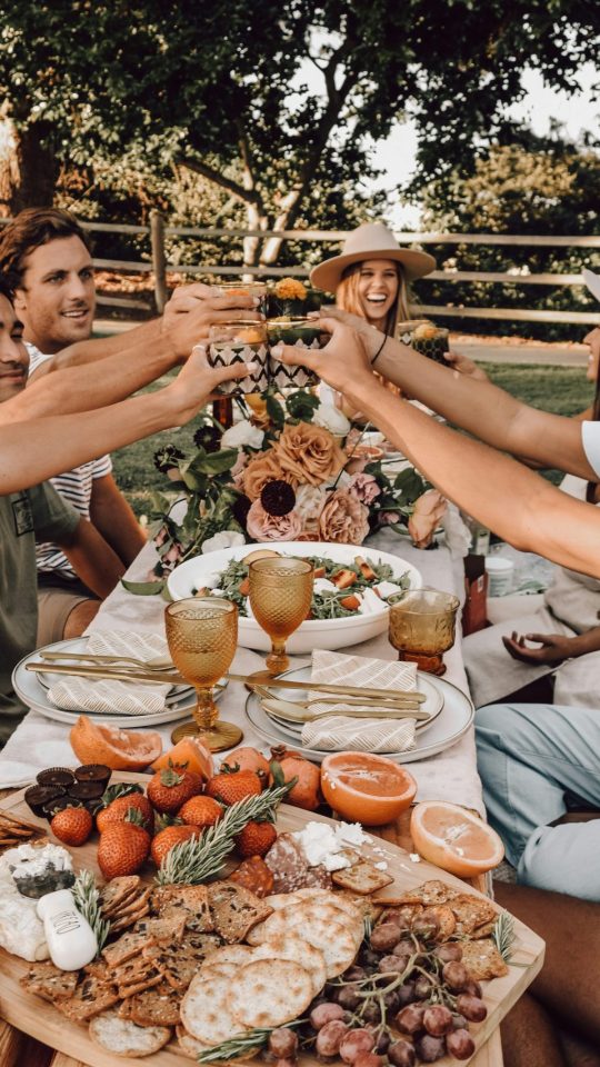 people sitting on chair eating food during daytime