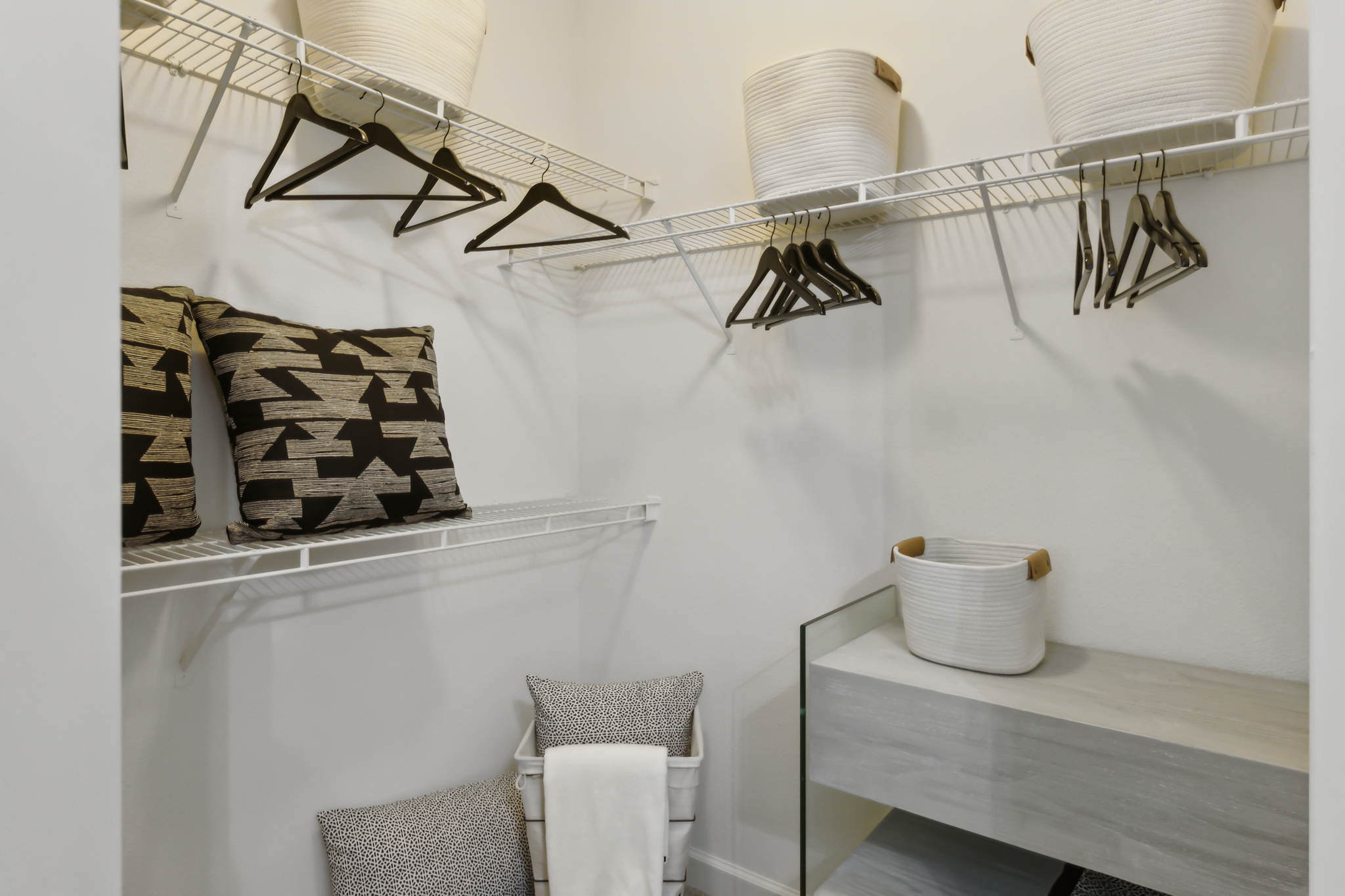 a walk in closet with shelves and clothes at The  Boulevard at Deer Park