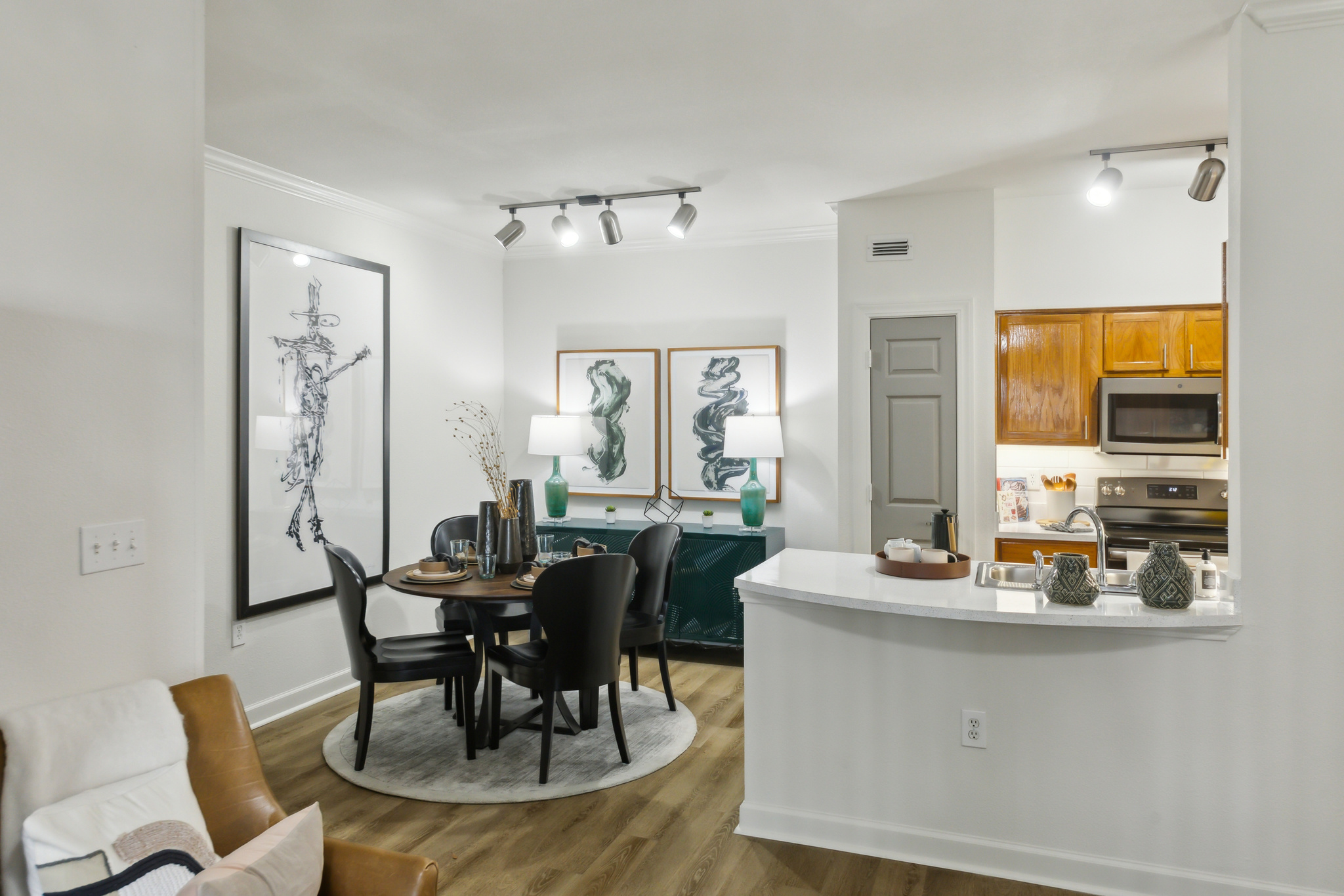 the kitchen and living room of a two bedroom apartment at The  Boulevard at Deer Park