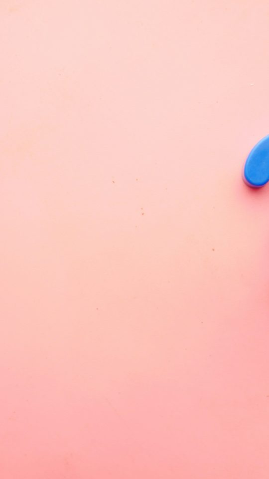 a blue question mark on a pink background