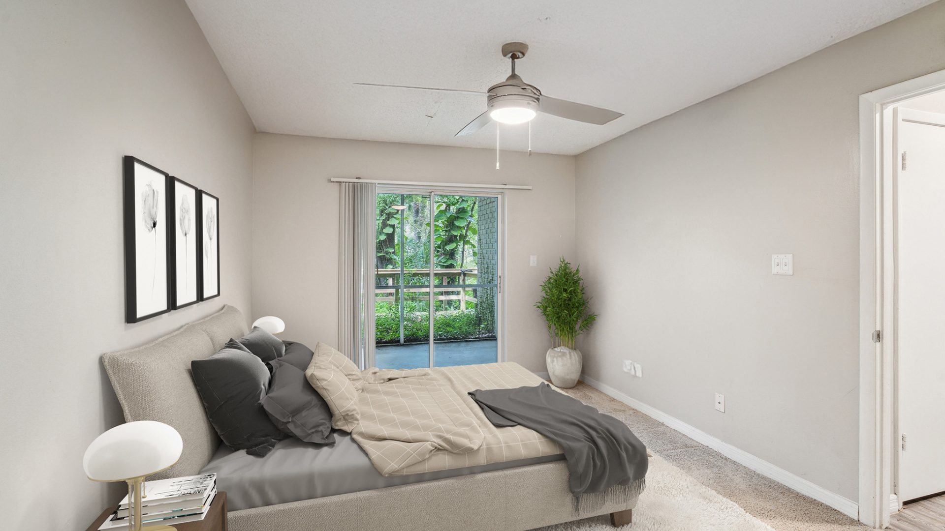 a bedroom with a ceiling fan and a bed at The  Brady at Tampa Palms