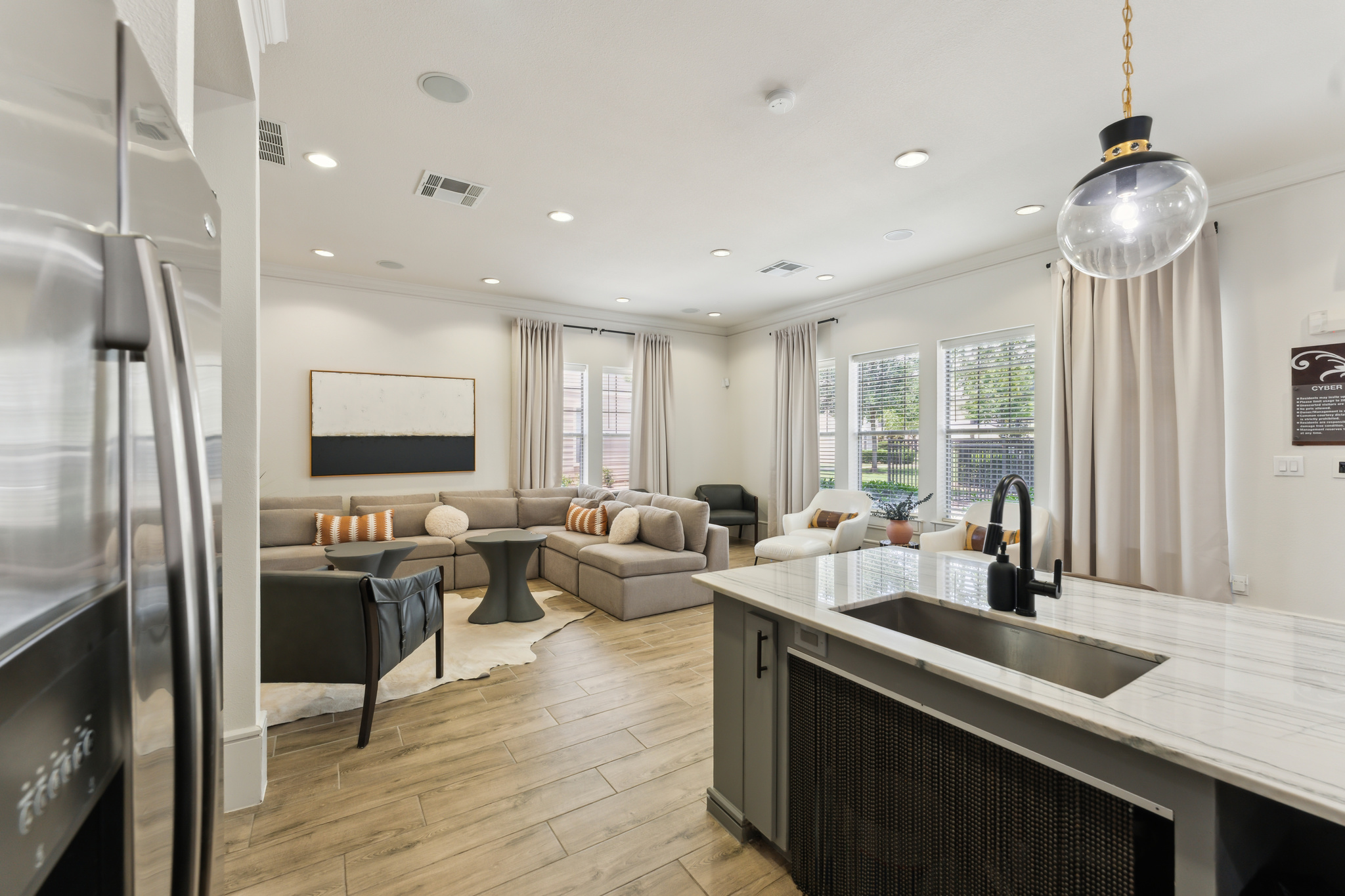 a kitchen and living room with a large island at The  Wyatt at Presidio Junction