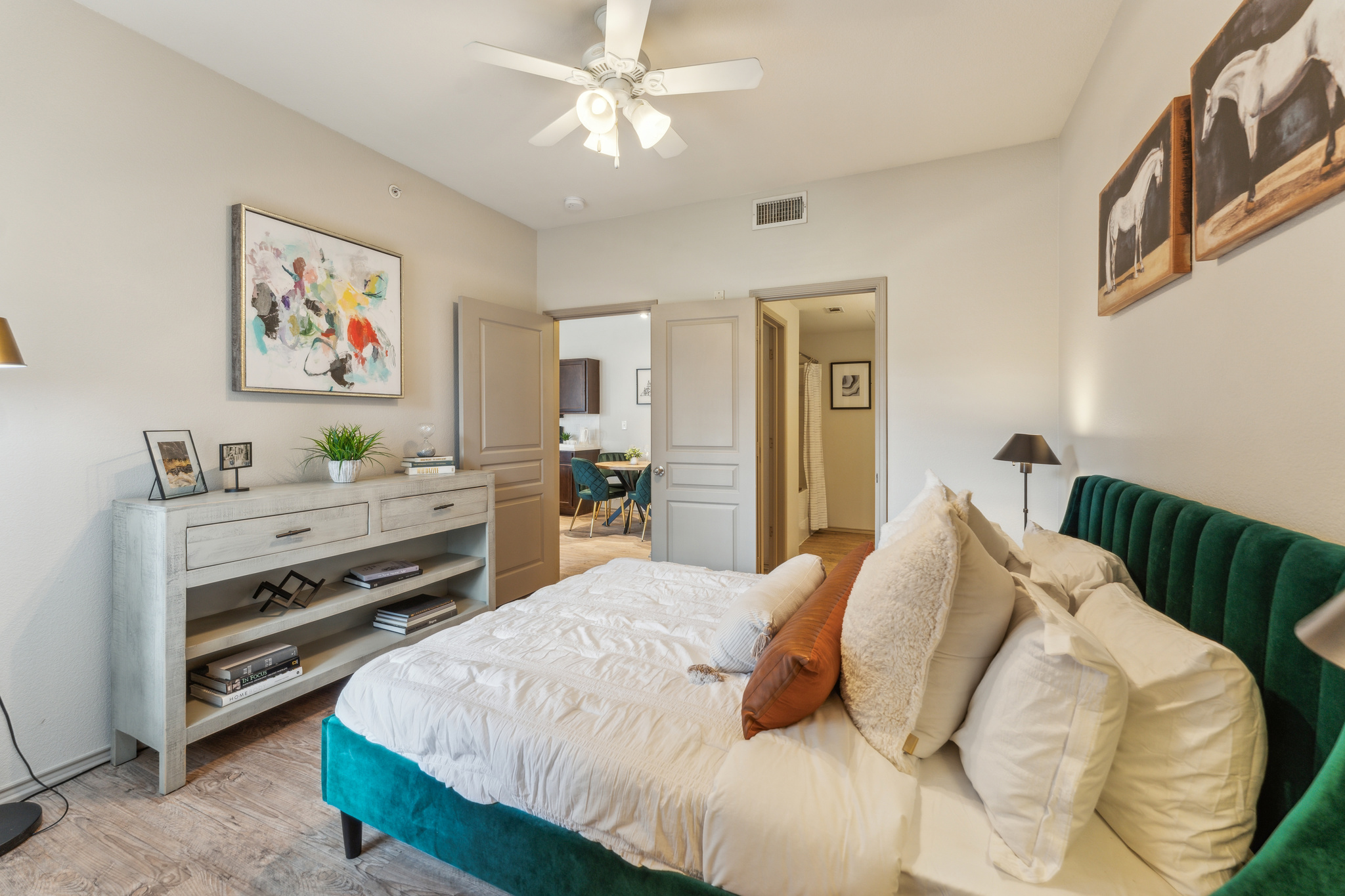 a bedroom with a bed, dresser and a television at The  Wyatt at Presidio Junction