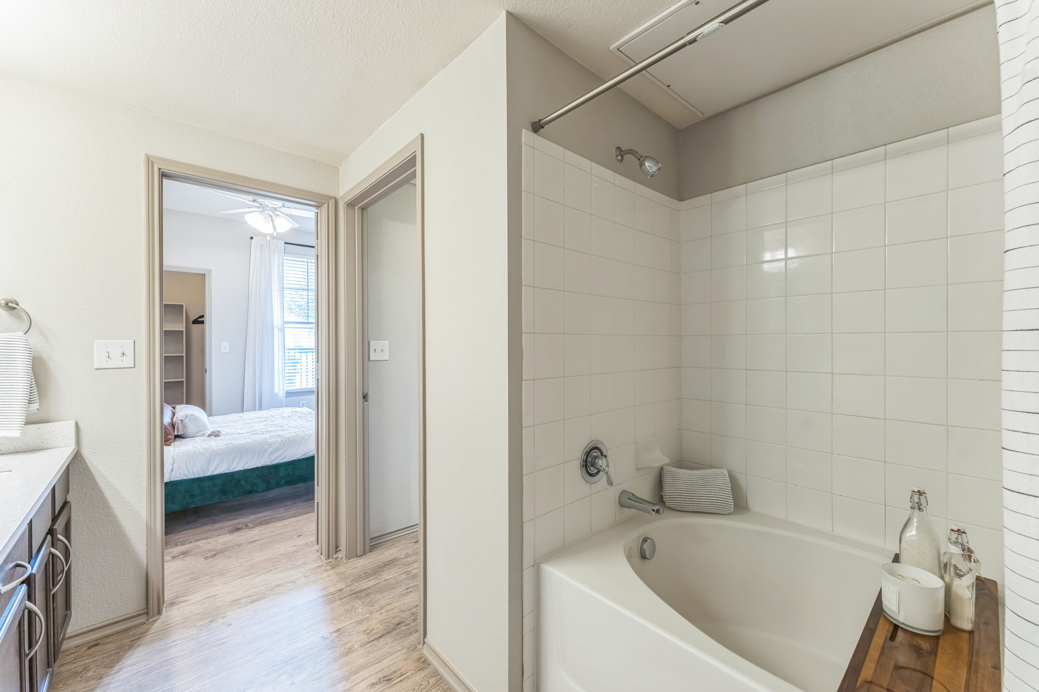 a bathroom with a tub and sink in it at The  Wyatt at Presidio Junction