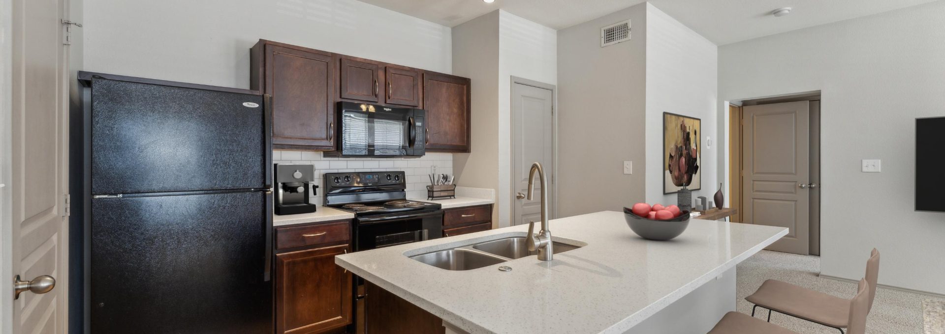 a kitchen with stainless steel appliances and black appliances at The  Wyatt at Presidio Junction