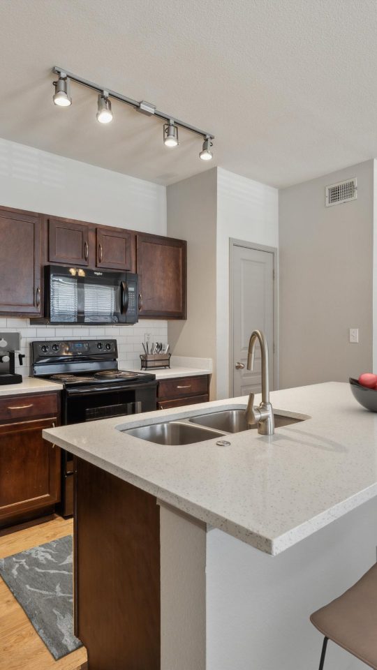 a kitchen with stainless steel appliances and black appliances at The  Wyatt at Presidio Junction