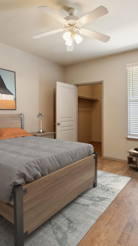 a bedroom with a bed, dresser, and nightstand at The  Wyatt at Presidio Junction