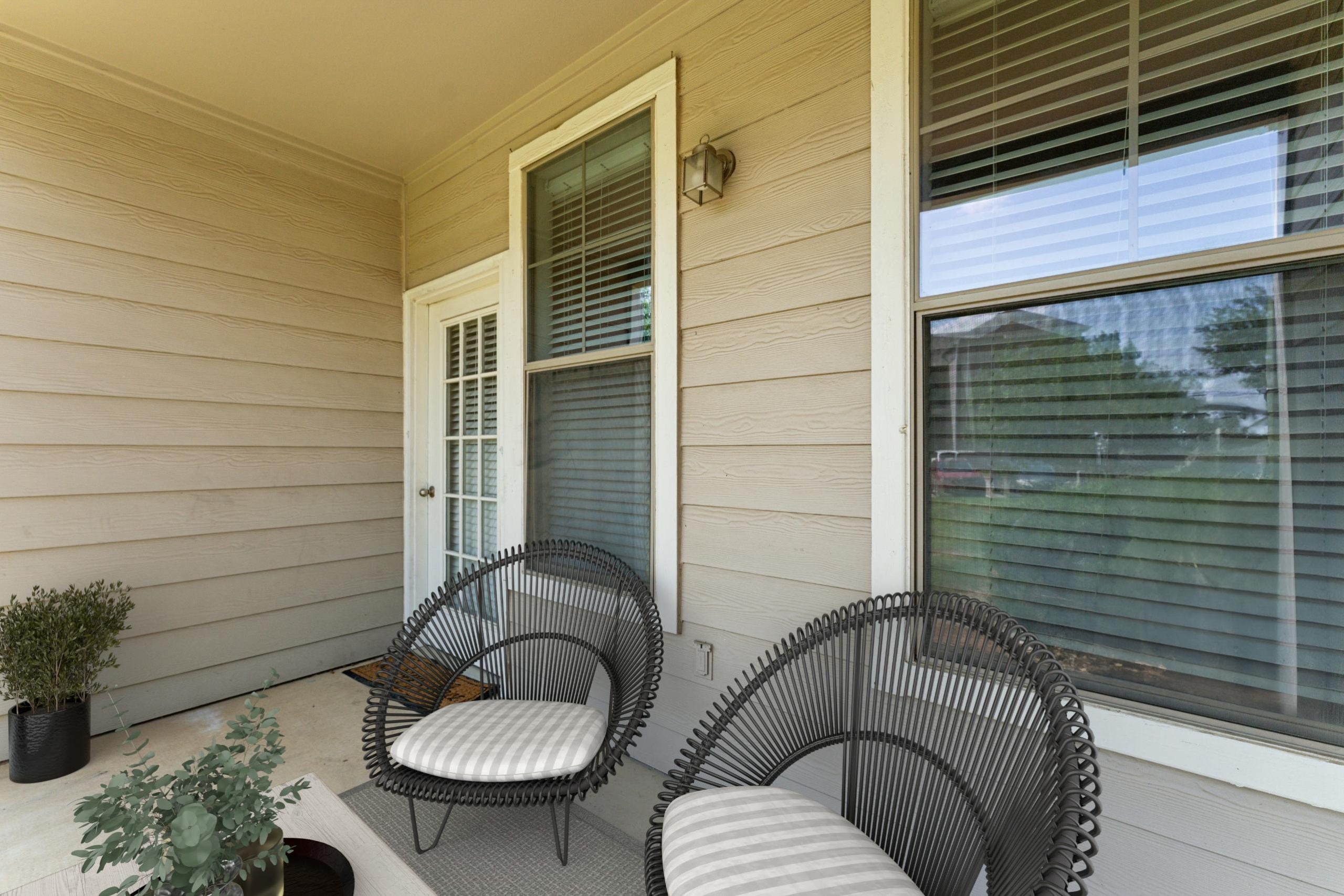 a patio with two chairs and a table at The Wyatt at Presidio Junction