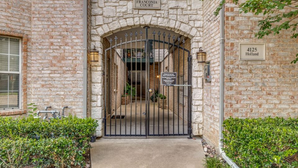 the entrance to a brick building with a gate at The Franconia Court