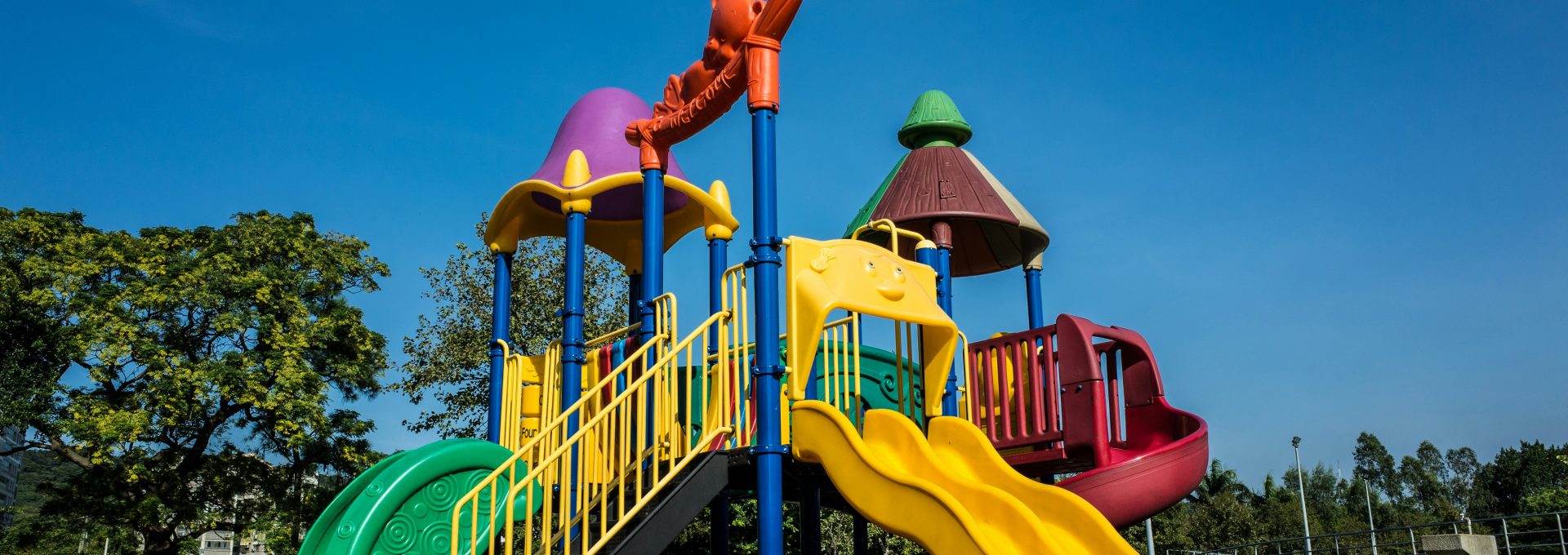 multicolored playground slide during daytime