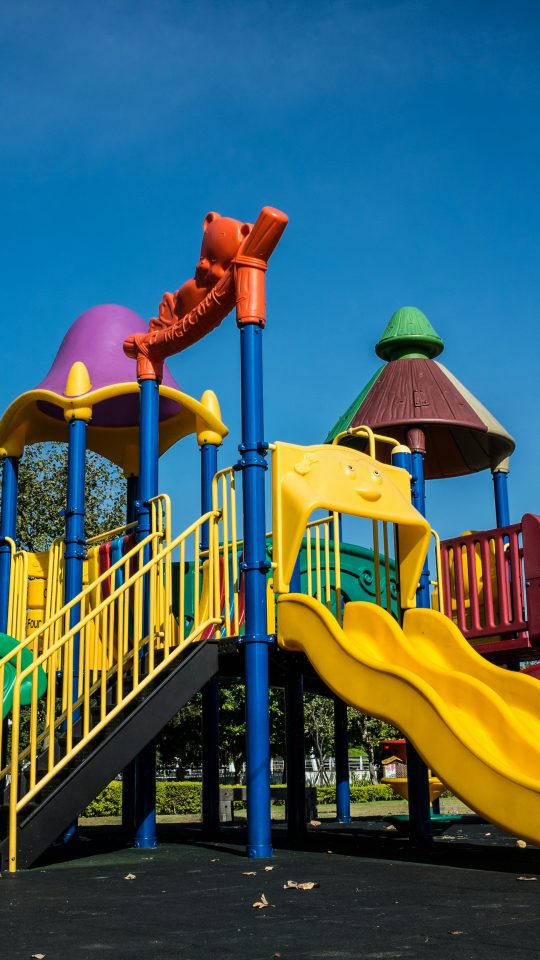 multicolored playground slide during daytime