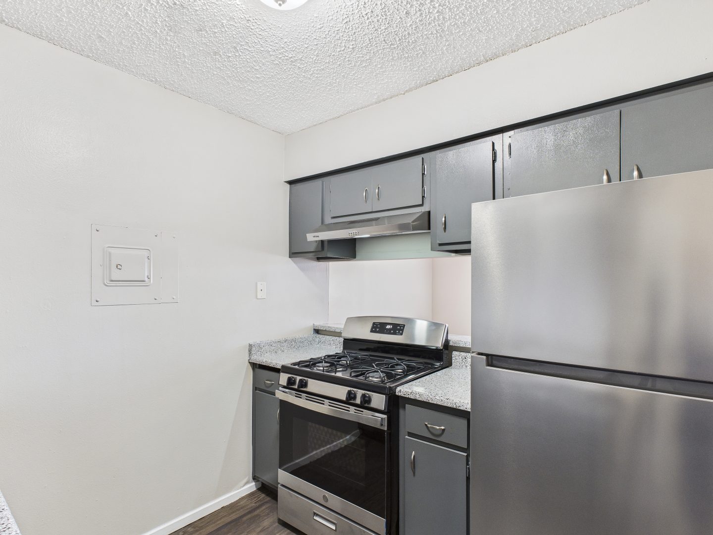 a kitchen with stainless steel appliances and a stove at The Eagle Rock Apartments
