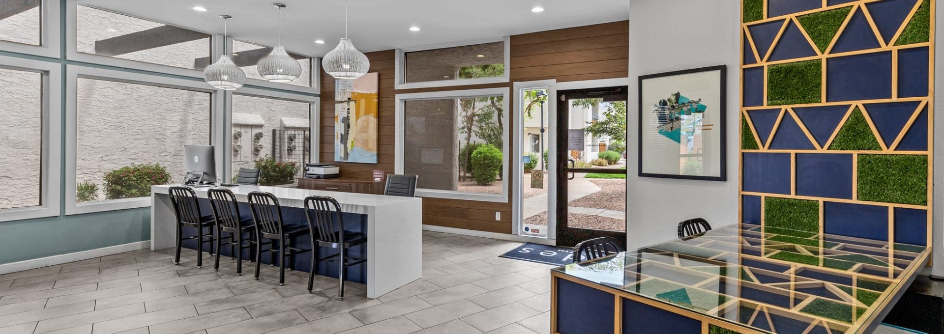 the lobby of a hotel with a colorful tile floor at The Tides on 27th