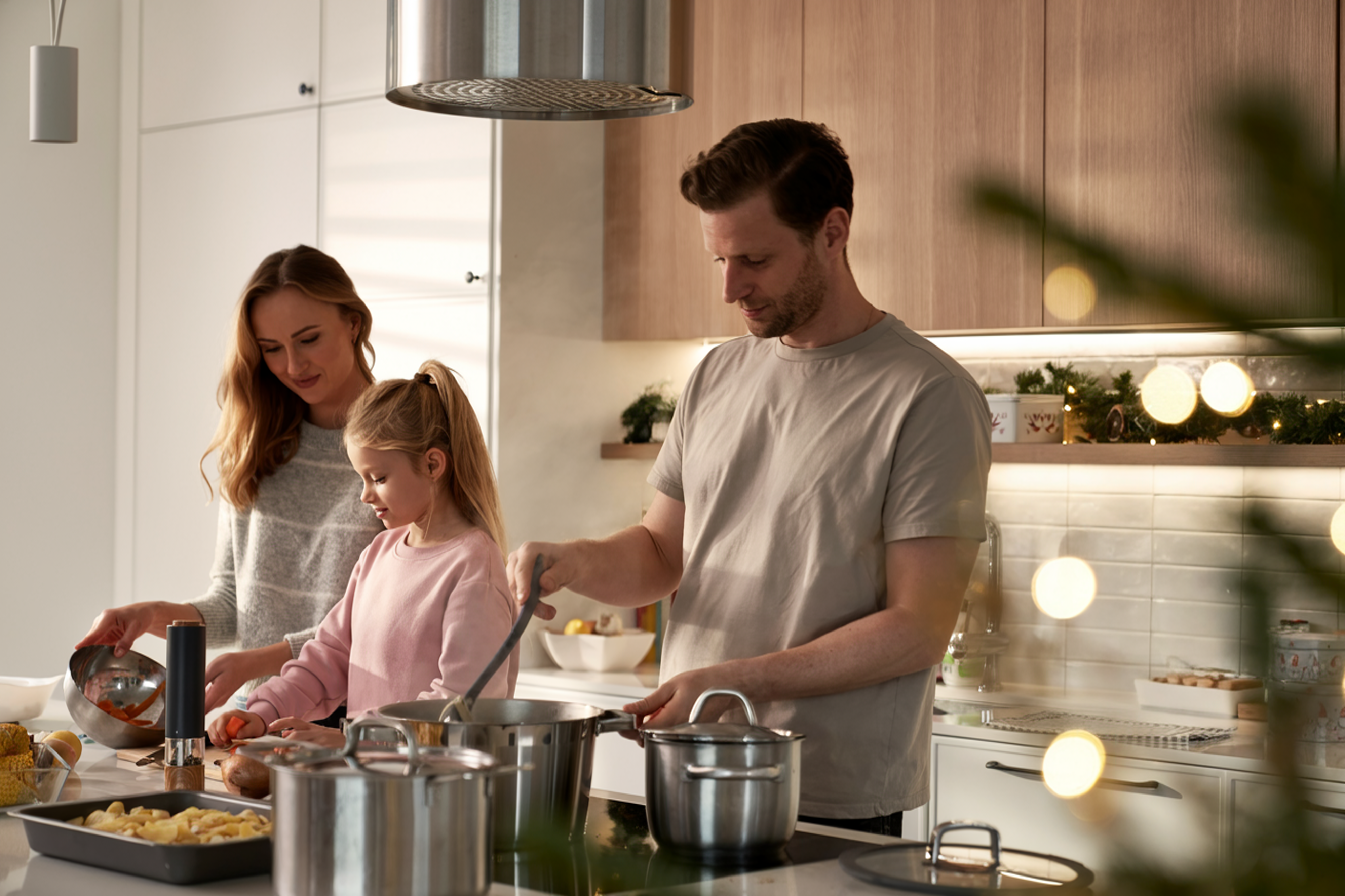 a family preparing food in the kitchen at The Woodview