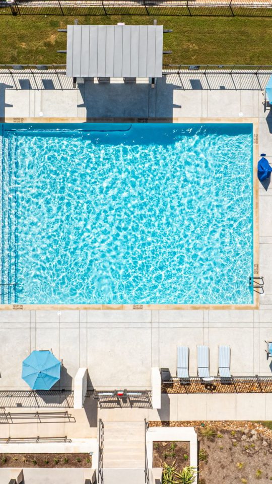 Resort-style pool with loungers, outdoor seating and grill, perfect to entertain family and friends