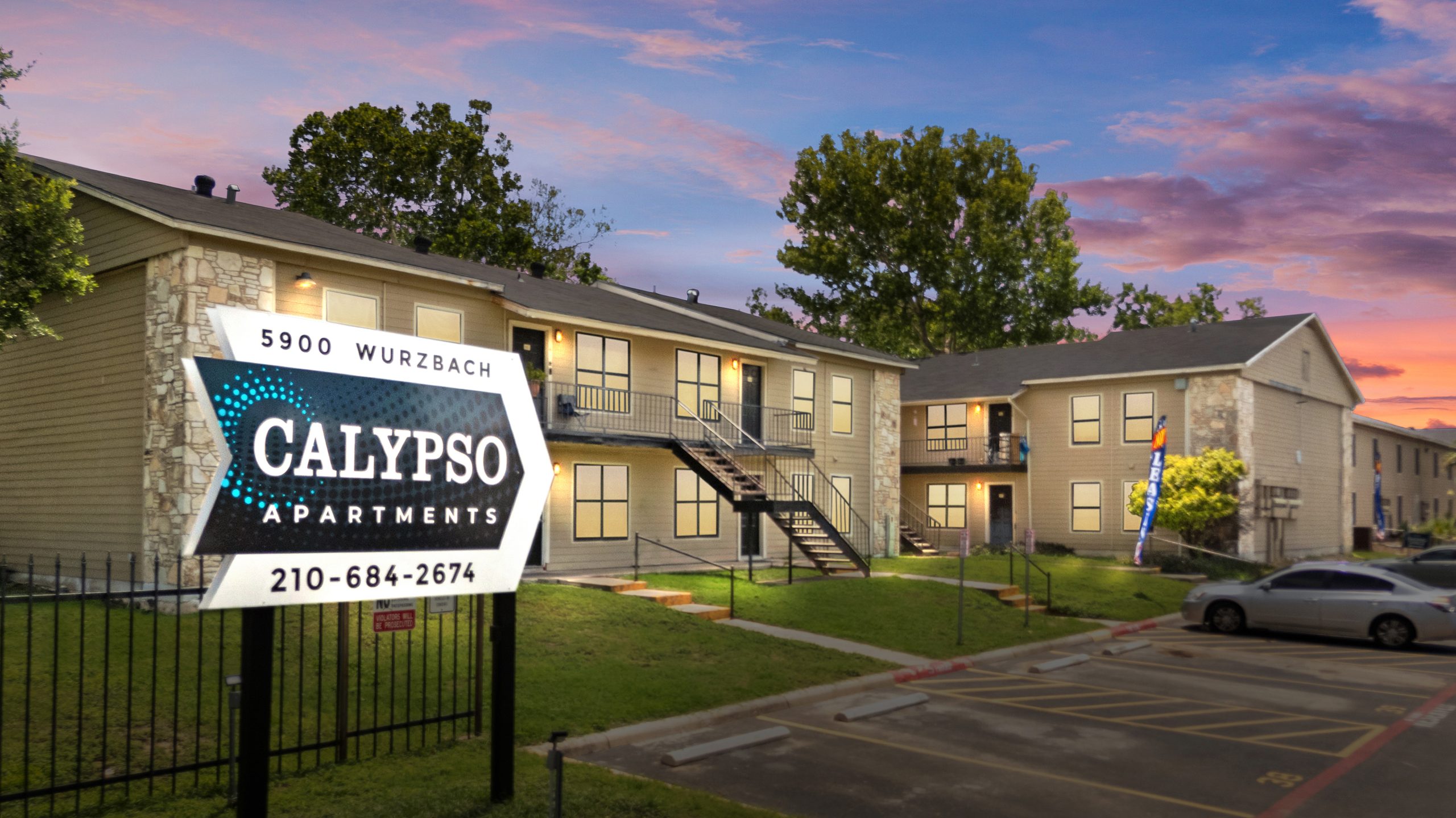 the sign for california apartments at sunset at The Calypso Apartments