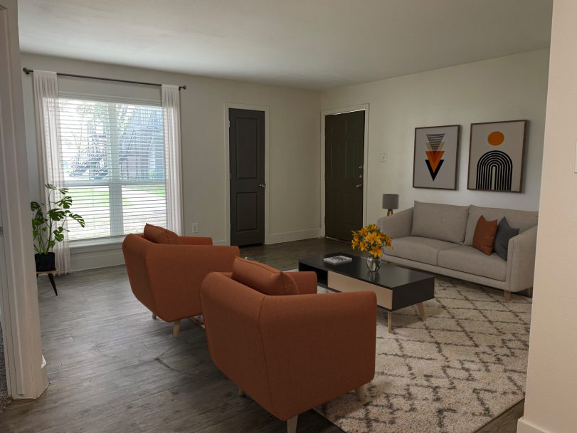 a 3d rendering of a living room with a couch and chairs at The Park Colony Apartments