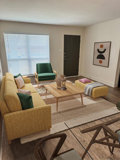 a 3d rendering of a living room with yellow furniture at The Park Colony Apartments