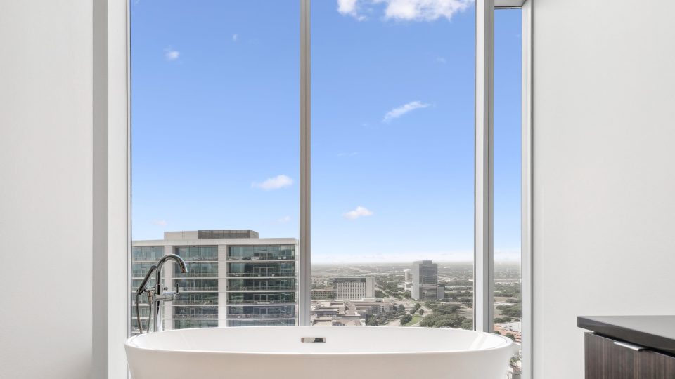 a bathroom with a large window overlooking the city at The LVL 29
