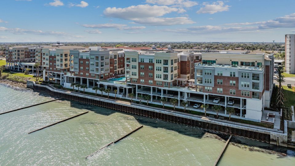 an aerial view of a waterfront apartment complex at The Alexa
