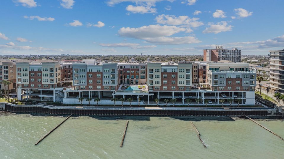 the apartment building is located on the water at The Alexa