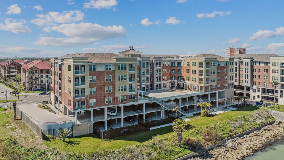 the apartment complex is located on the waterfront at The Alexa