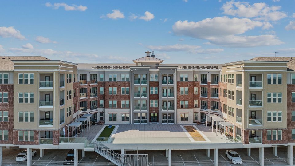 the exterior of a multi - story apartment building at The Alexa