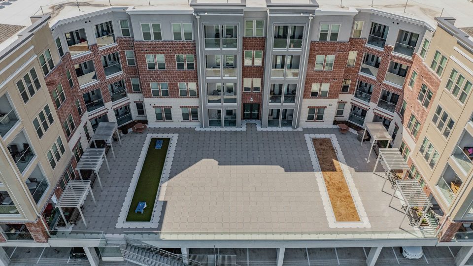 an aerial view of a courtyard with a fountain at The Alexa