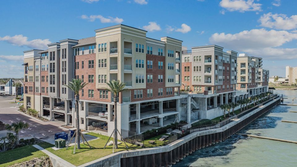 the apartment complex is located on the waterfront at The Alexa