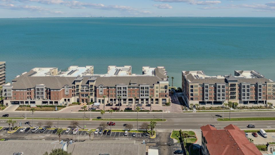 an aerial view of a beach and ocean at The Alexa