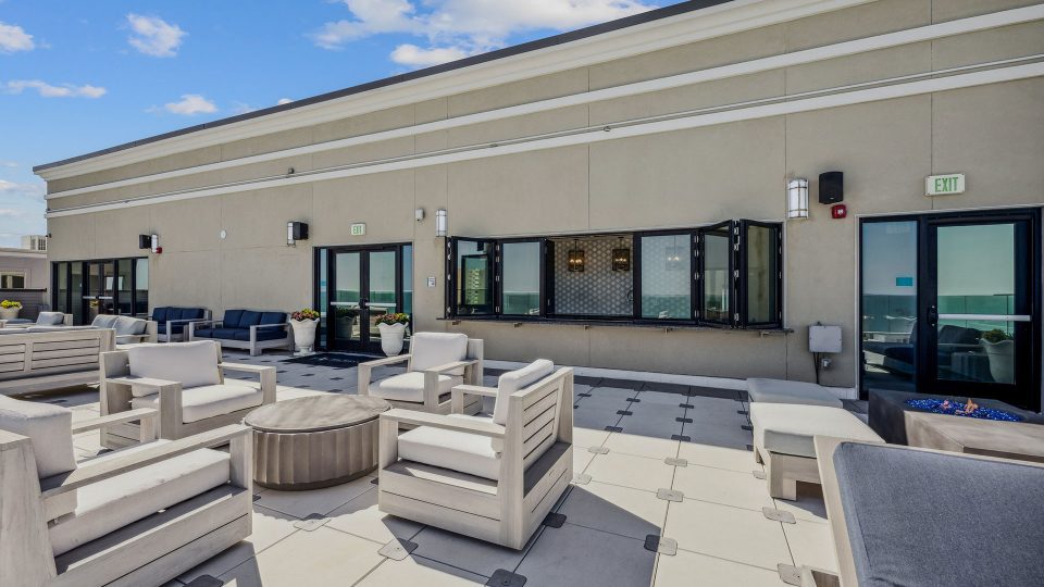 patio furniture and a large patio with a view at The Alexa