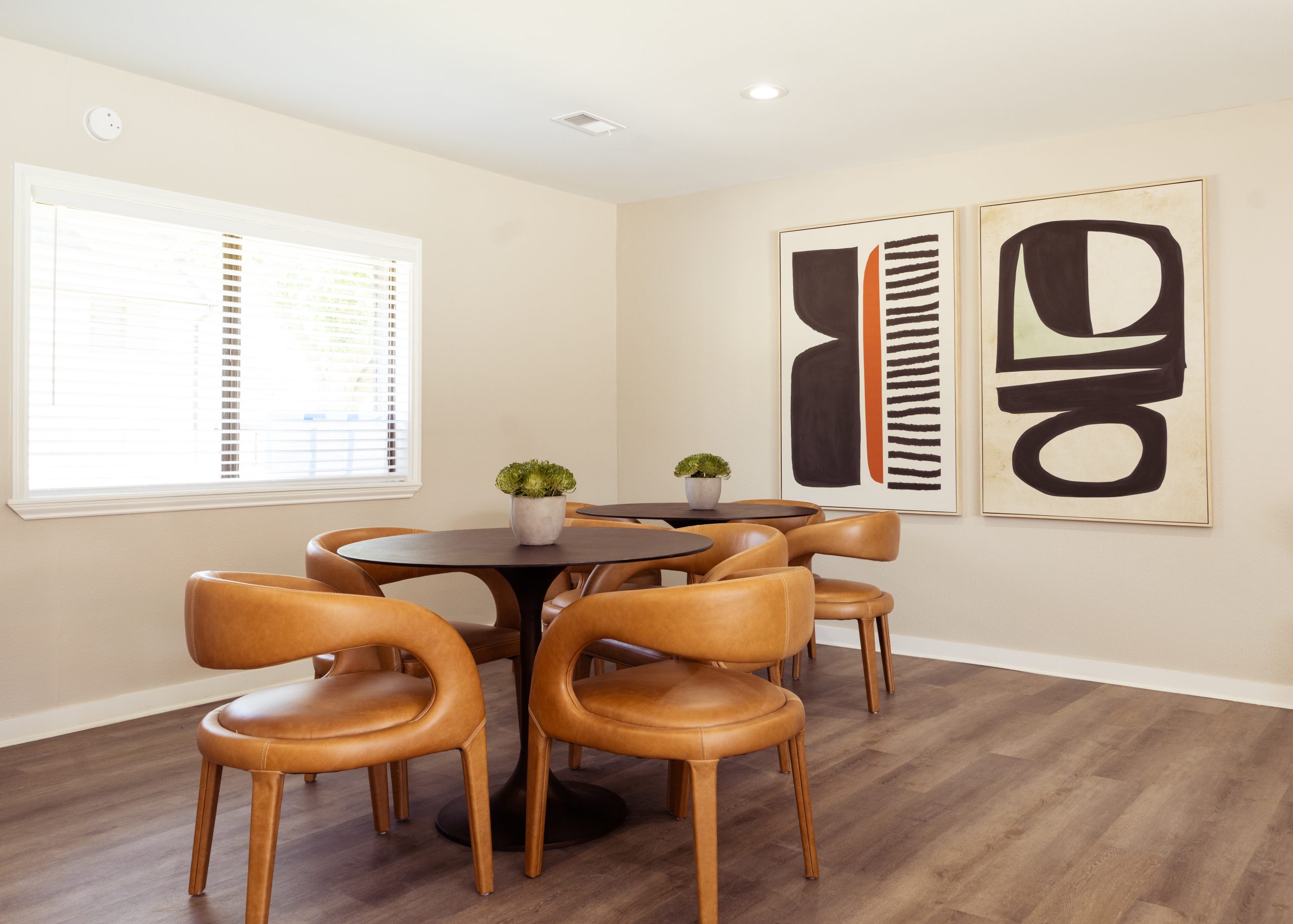 a dining room table and chairs in a room