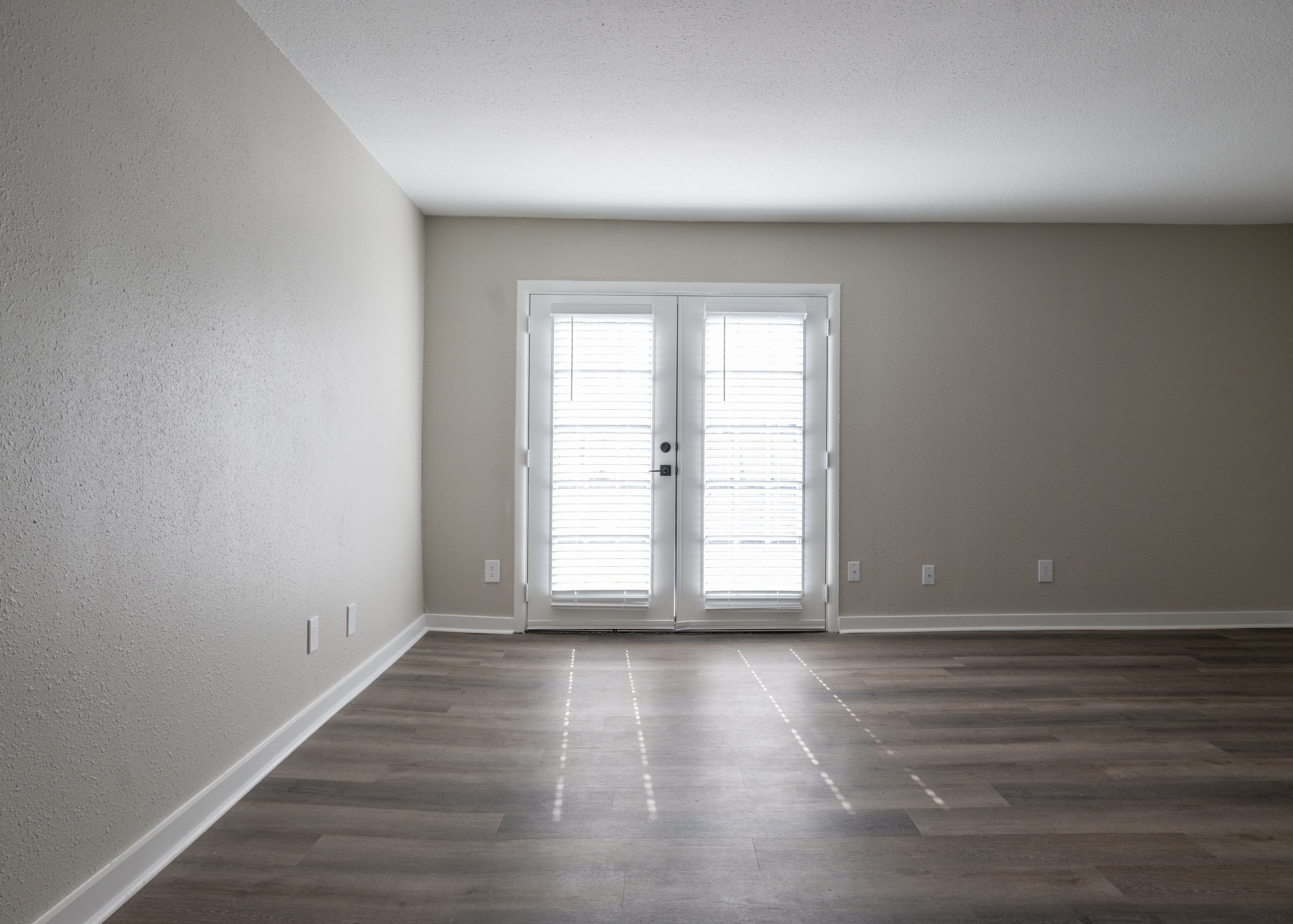 a room with a white floor and a white wall