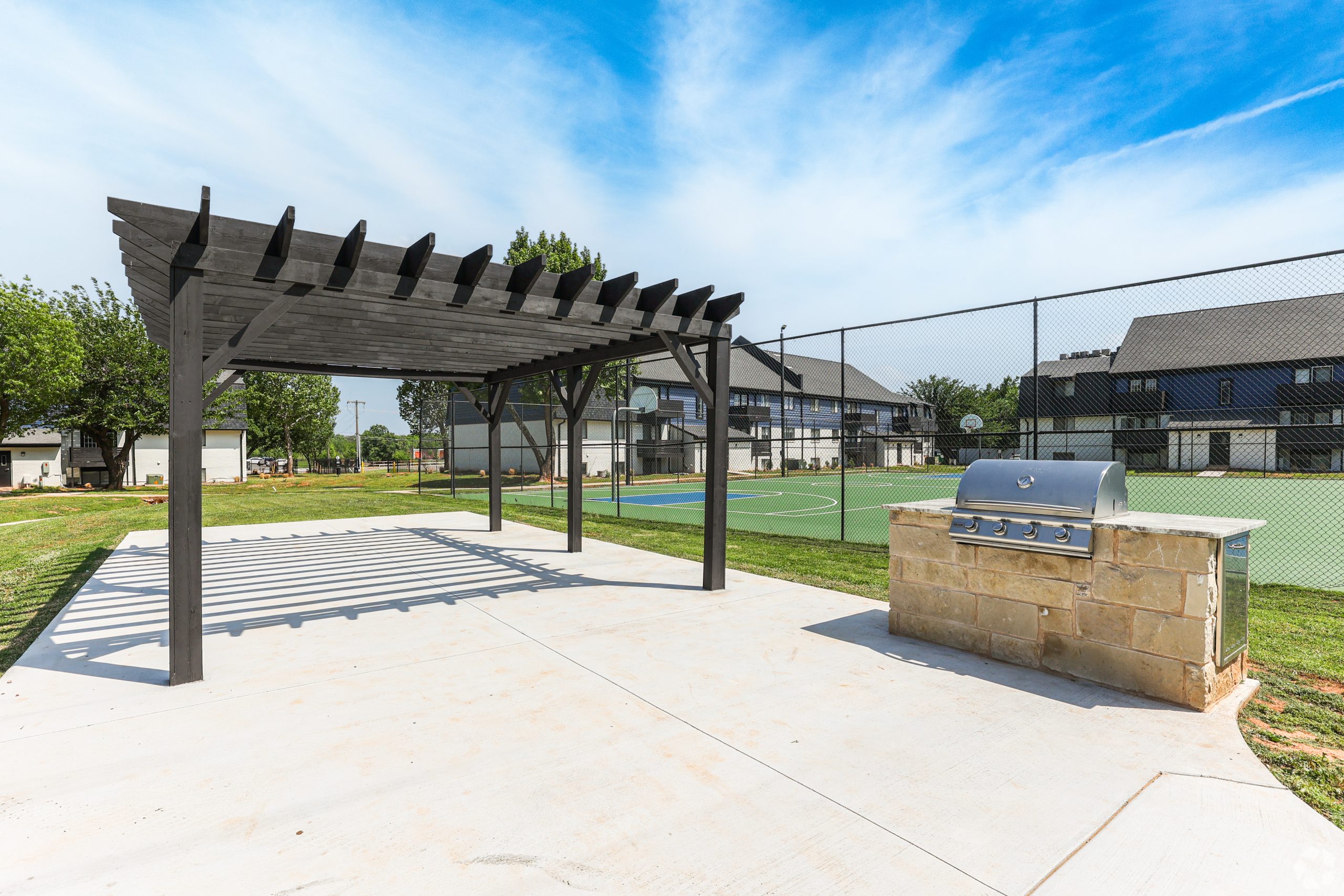 a park bench in front of a brick building