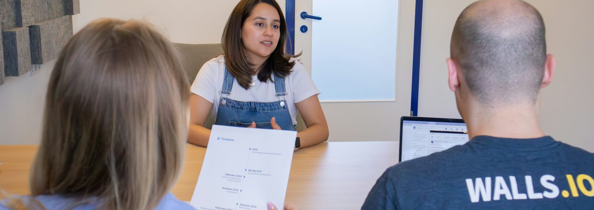 a group of people sitting around a table