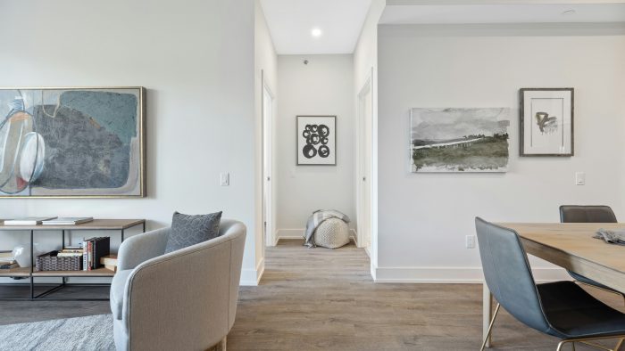 white and gray sofa chair near white wall